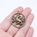 Vintage style bronze crow pentagram moon pendant charm shown held in hand for scale - Hollow Pentagram Raven (A13600)