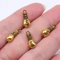 Small vintage gold-finished money bag charm with dollar sign for DIY jewelry making - 10 Pieces Pack / Antique Gold