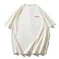T-shirt blanc cassé oversize à épaules tombantes avec imprimé graphique - 3XL / Hauts / Abricot Beige