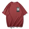 Oversized brick red men's graphic T-shirt featuring NEVAR UN print and drop shoulder fit - 2XL / Tops / Wine Red