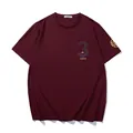 Stylish oversized burgundy men's T-shirt featuring gold and reflective graphic prints. - XL / Tops / Wine Red