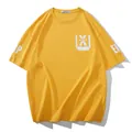 Oversized yellow cotton t-shirt with white graphic prints and a drop shoulder fit - Yellow