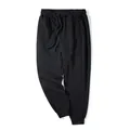 Men's plus size black jogger sweatpants featuring elastic drawstring waist and cuffed legs - 2XL / Bottoms / Black