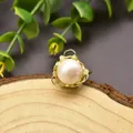 Detail of handmade gold wire wrapped ring featuring a large white freshwater pearl - Size 5 / Exquisite Woven Pearl