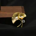 Elegant ginkgo leaf brooch featuring natural freshwater pearls and sparkling crystal accent - Dual Pearl Brushed Ginkgo Leaf Style