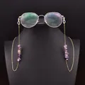 Elegant purple amethyst glasses chain with gold-plated links shown on a black bust display - Amethyst Symmetrical Eyeglass Chain