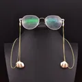 Elegant gold-tone eyewear chain featuring delicate white seashell pendants for women's glasses - Natural Shell Pearl Pendant Glasses Chain
