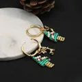 Elegant handmade Christmas hoop earrings featuring beaded tree and golden reindeer charms - Hoop Earrings / Green Christmas Tree Hoop Earrings
