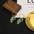Beautiful handmade Christmas hoop earrings with beaded tree and golden reindeer - Green Christmas Tree Hoop Earrings