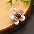 Exquisite close-up of baroque pearl flower brooch with blue lapis lazuli center - Lapis Lazuli Flower Pearl Brooch