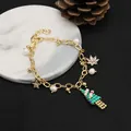 Festive gold charm bracelet with natural pearls and a handmade beaded Christmas tree - Green Christmas Tree Bracelet