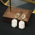 Vintage gold relief cameo earrings with natural white baroque pearl pendants - White Portrait Studs