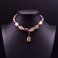 Handmade baroque freshwater pearl necklace with bronze pendant shown on black bust - Square Colorful Baroque Pearl Necklace