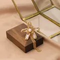 Elegant natural freshwater pearl flower brooch with dangling gold chain fringe - Five Baroque Pearl Tassel Style (GO0332C)