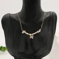 Elegant natural pearl necklace featuring gold heart chain and a butterfly pendant - Opal Butterfly Pendant Necklace (ALGN0276)