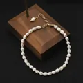 Elegant natural white freshwater pearl bracelet with adjustable gold-tone clasp - Rice Pearl Minimalist Bracelet / Rice Bead Style / White