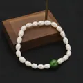 Elegant handmade white freshwater pearl bracelet with a single round green bead for women - Green Jade Elastic Bracelet / Green Jade Style / White & Green