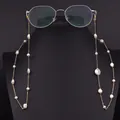 Elegant natural baroque pearl glasses chain on a black display bust with eyewear props - Baroque Big Pearl Eyeglass Chain