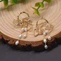 Elegant Baroque freshwater pearl earrings with golden hoops and clear amber accents. - Light Citrine