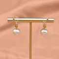 Elegant baroque pearl drop earrings with gold ornate detailing and small crystals - Zirconia Edison Earring Style