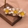 Elegant vintage natural pearl flower hair clip with yellow stone accents on wooden stand - Yellow Topaz Stone Flower Hair Clip