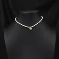 Elegant natural white pearl choker necklace featuring a golden filigree heart pendant design - Hollow Heart Single Layer Necklace