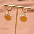 Elegant Baroque pearl drop earrings featuring a yellow gemstone center in gold wire wrap - Yellow Topaz Sun Flower Style