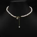 Elegant minimalist natural pearl necklace featuring a gold Fu character pendant charm - Fu Medallion Set Necklace