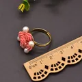 Handcrafted vintage pink carved flower ring with natural pearls on gold band - Coral Pink Embossed Style