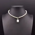 Elegant natural pearl choker with a square baroque pearl pendant on black bust display - Square Baroque Pearl Pendant Necklace