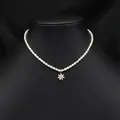 Elegant natural pearl choker necklace featuring a dainty gold-toned flower pendant - Zirconia Snowflake Pearl Necklace