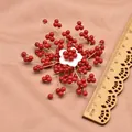 Handmade vintage red branch brooch with white shell flower and wooden ruler for scale - Pentagonal Coral Corsage