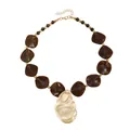 Vintage style necklace featuring irregular brown resin beads and a gold leaf pendant - Brown