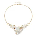 Elegant gold-tone necklace featuring white enamel abstract pendants and rhinestone accents - Necklace / Gold