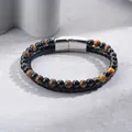 Close-up detail of braided leather bracelet with tiger eye beads and steel clasp. - Yellow and Black Beaded Bracelet
