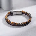 Macro detail of natural tiger eye stone beads and braided leather bracelet with magnetic clasp. - Yellow Tiger Eye Bracelet