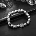 Detailed macro view of hip hop Buddha head and Bagua silver beaded bracelet for men - Silver Bead Style (S483-A)