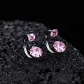 Close-up of F136 titanium horseshoe earrings with faceted pink cubic zirconia stones. - Pink (XT070-B)