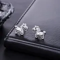 Macro detail of minimalist silver horse shaped stud earrings with polished finish on leather - Prosperity Horse Stud Earrings (X1166-A) / 1 Pair Pack / Silver