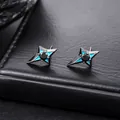 Detail macro shot of black four-pointed star stud earrings with blue enamel accents - Four-pointed Star Stud Earring (X1289-A)