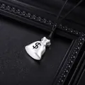 Macro view of a silver money bag pendant with a dollar sign on a black cord necklace - Leather Cord (L1137-B) / Silver