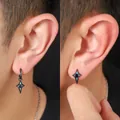 Trendy black four-pointed star stud and drop earrings shown on a male model's ear. - Four-pointed Star Jewelry Set (X1291-A+X1289-A)