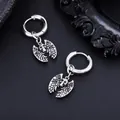 Detailed close-up of gothic bat skull pendant on stainless steel silver hoop earrings - Bat Wing Skull Style (X1192-A) / 1 Piece