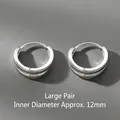 Detail view of large silver hoop earrings with a 12mm inner diameter, minimalist. - 12mm / Silver