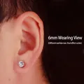 Detailed close-up shot of a 6mm minimalist silver stud earring worn on a male earlobe - 6mm 1 Pair / Silver White Rhinestone