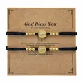 Juego de dos pulseras trenzadas con medalla de oro en una tarjeta regalo bautizo - Juego Tarjeta Bautismo (S26070209D-P)