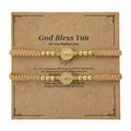 Juego de dos pulseras religiosas tejidas a mano con medallones de oro en tarjeta de bautismo - Juego Tarjeta Bautismo (S26070209B-P)