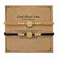Juego de pulseras tejidas de San Benito con cuentas doradas en tarjeta de regalo - Juego Tarjeta Bautismo (S26070209F-P)