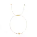 Minimalist cream woven cord bracelet featuring a polished gold-tone cross charm - Beige Bead Style (JS-B24102602A)