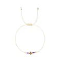 Minimalist adjustable woven string bracelet featuring purple beads and a gold-tone cross - Dark Purple Bead Style (JS-B24102602K)